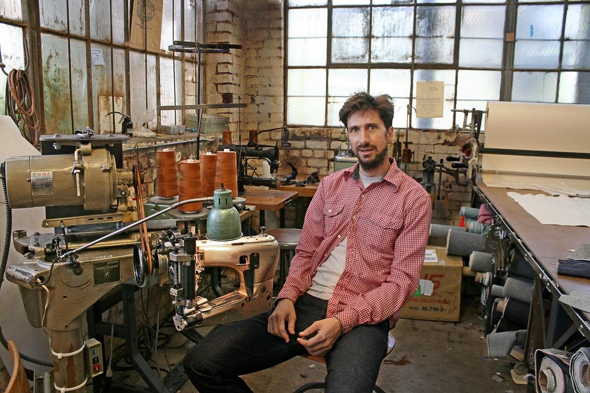 Roy Slaper in his Oakland workshop with a JUKI sewing machine